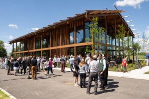 Attendees at the park's grand opening gather outside the visitor's center at Great Council State Park