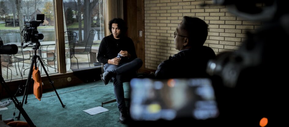 From left, Eli Hiller, 27, interviews his donor father Danilo Casiño, 53, at his childhood home in Akron, Ohio on December 5, 2021. (Photograph by Prince Shakur)