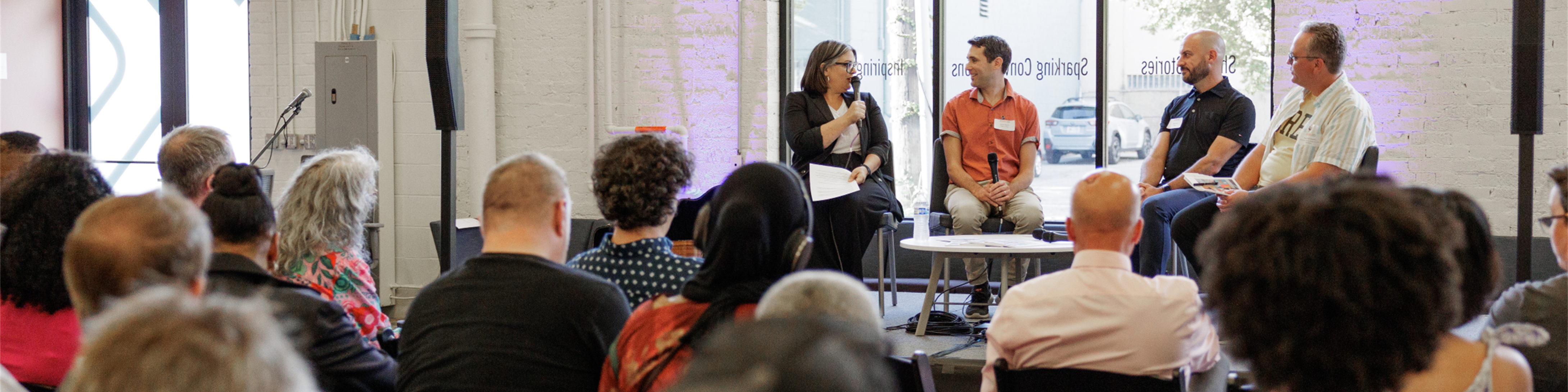 An audience listens to a panel discussion about the 2025 issue of Lumen magazine at the Ohio Humanities office