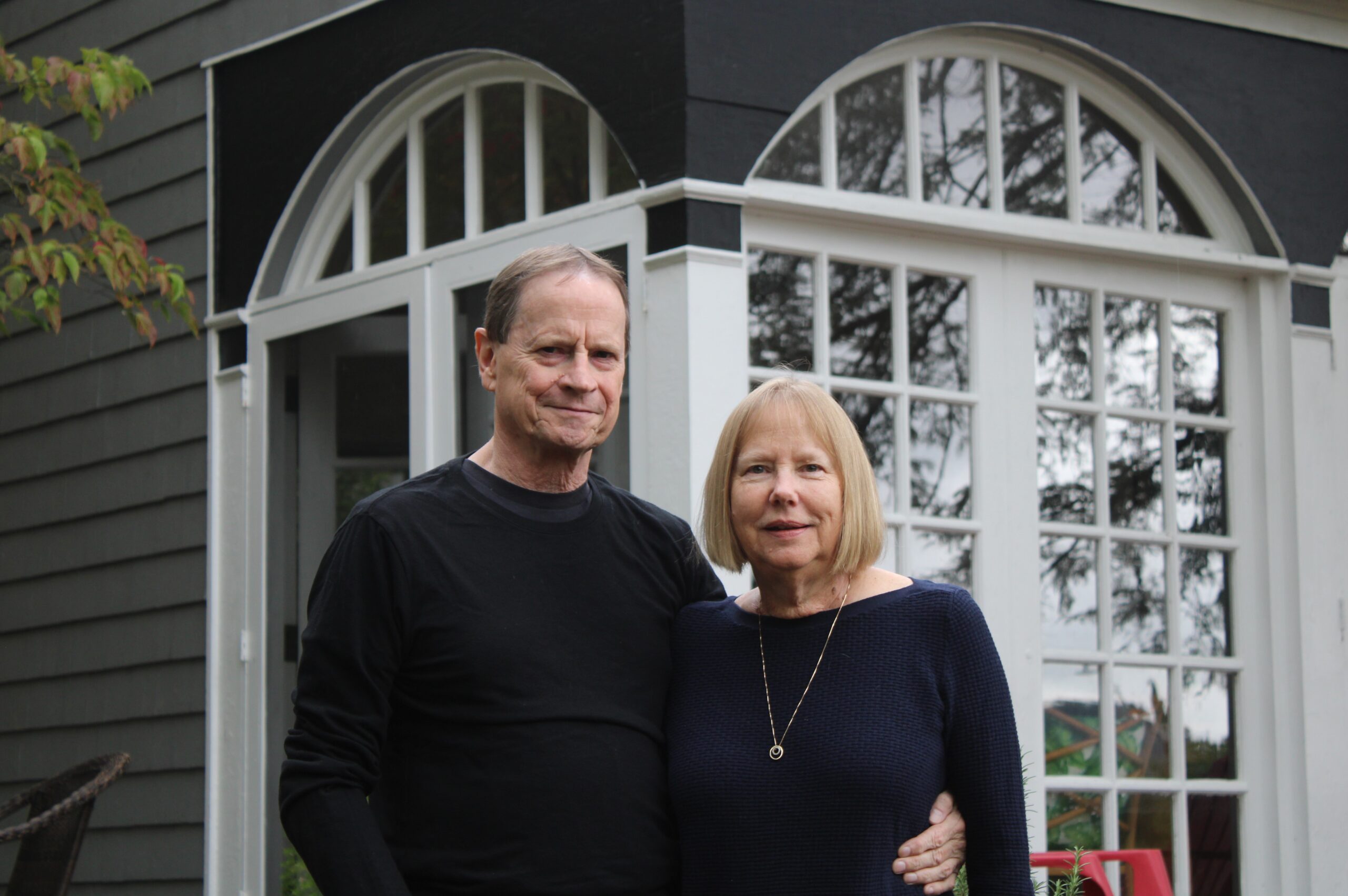 David Descutner, left, and DeLysa Burnier, right, pictured outside their Athens home